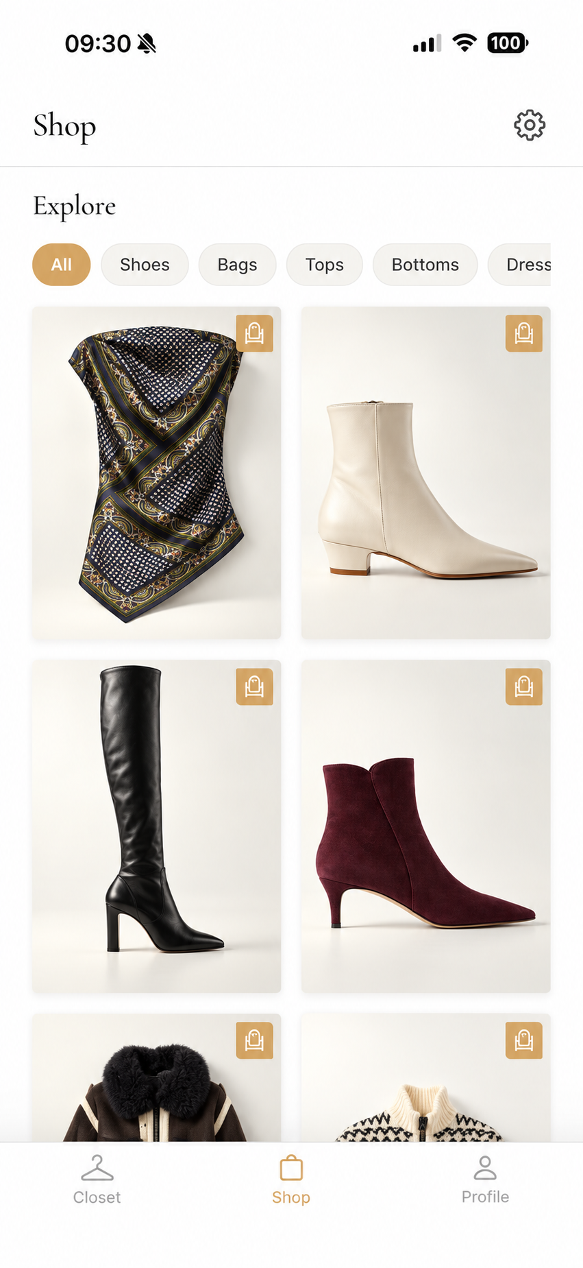 Aurel shop displaying fashion pieces including scarves and boots
